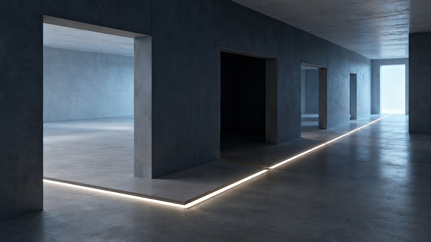 An empty architectural production space with one dark zone interrupting an otherwise continuous workflow