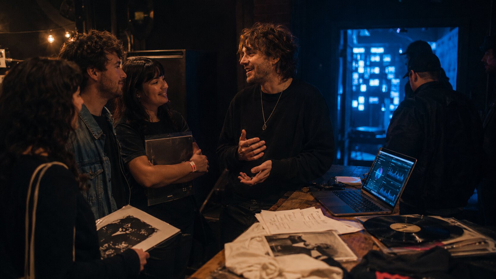 Independent musician connecting with real fans after an intimate live show