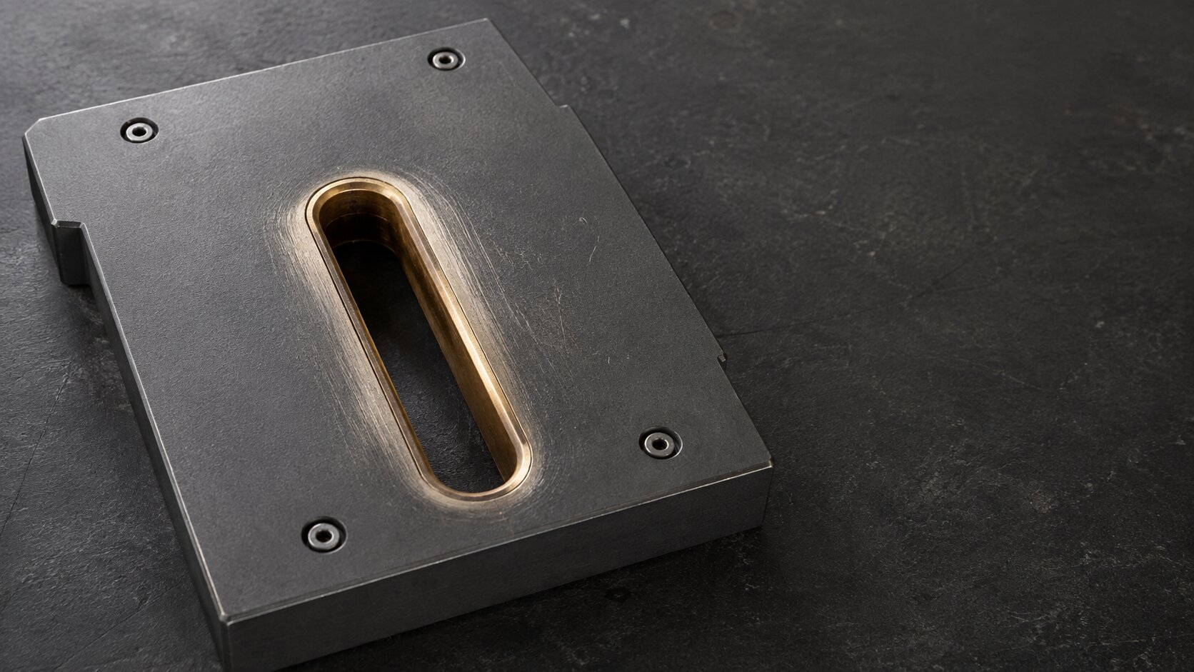 A precision metal gauge shows concentrated wear around one exact guide opening, representing repeated support questions revealing the specific point that needs a focused visual answer.